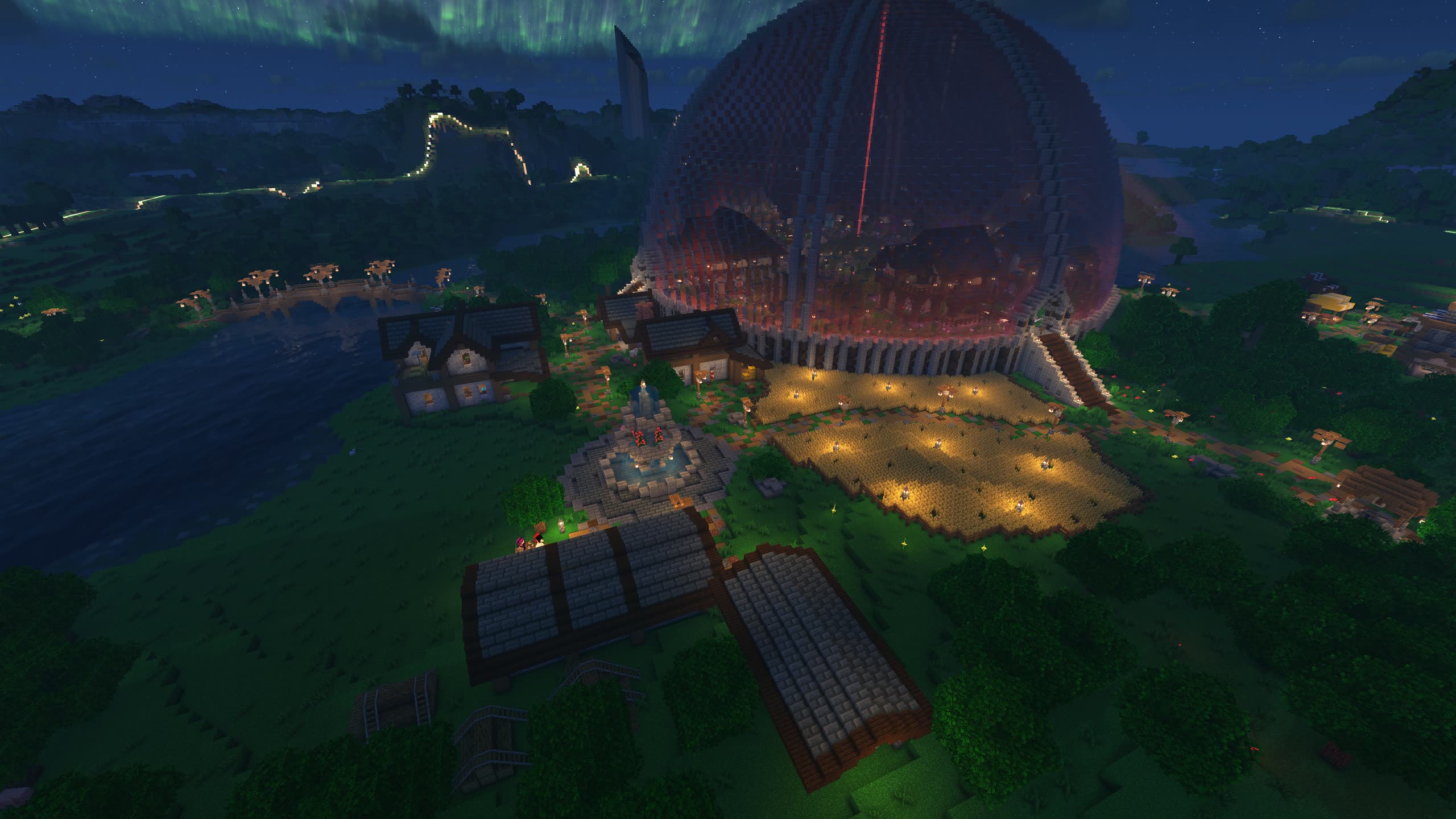 The settlement seen from above at dusk – river, houses, farms and the domed build